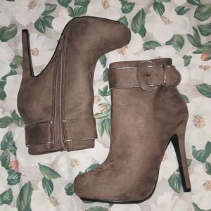 Zipup Heeled Boot With Chrome Trim And Buckle Accent